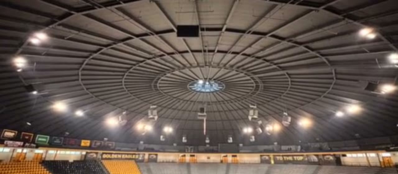 Finished arena interior with coated steel roof structure