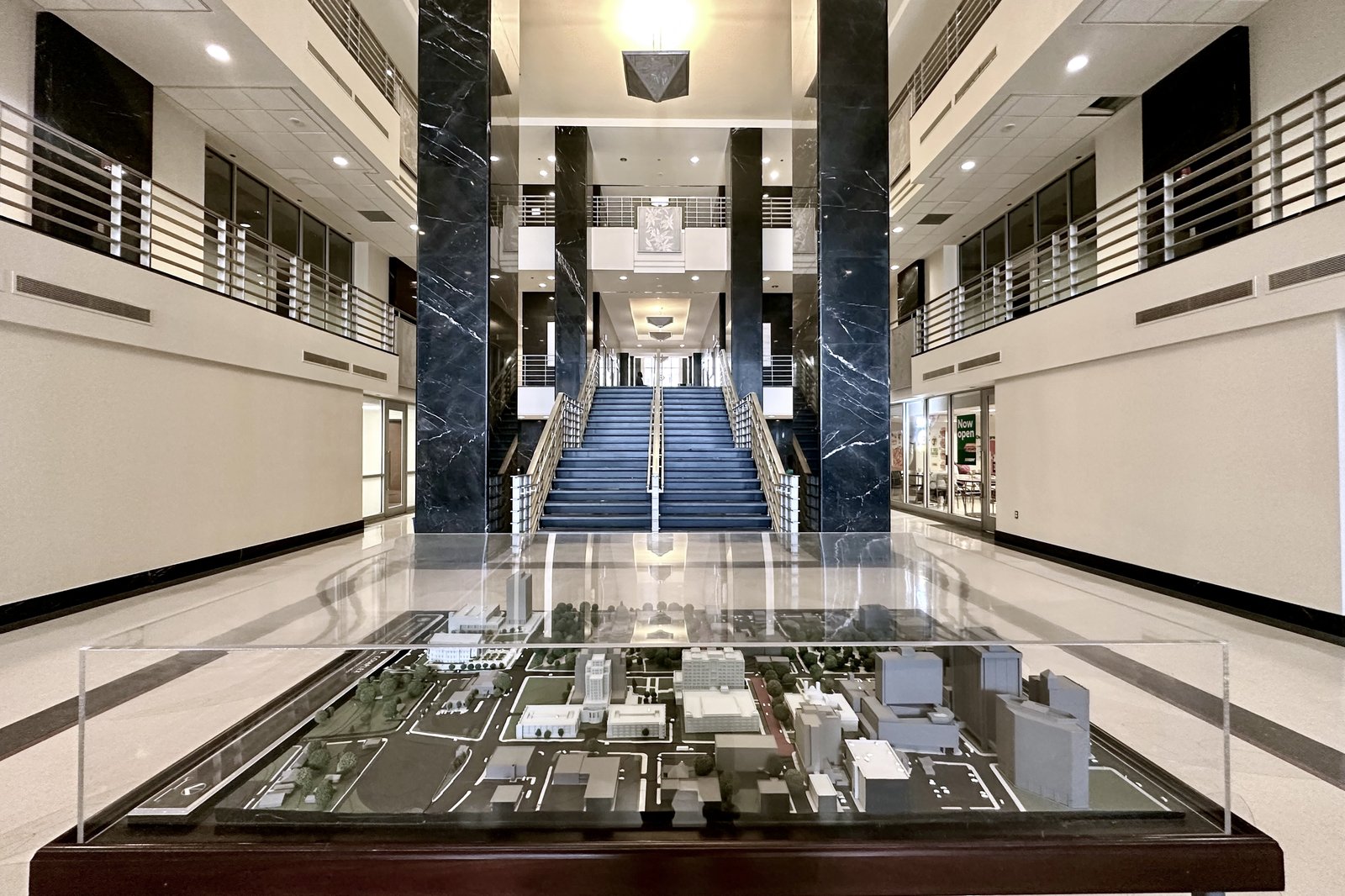 Atrium stairs with an architectural model in the foreground